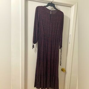 A modest dress with red poka dots